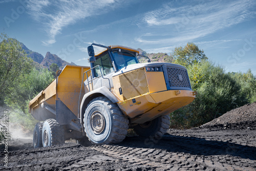 Articulated dump truck on a construction site.