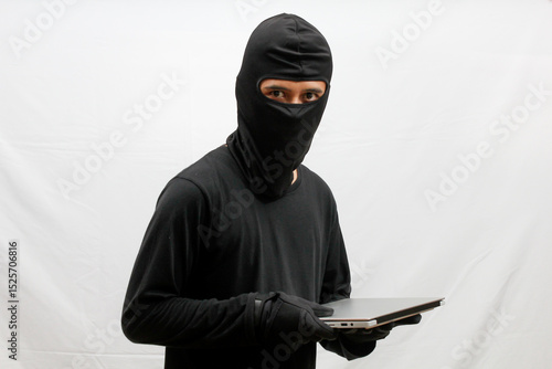 Obraz na plátně thief stealing laptop computer isolated white background
