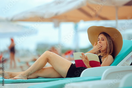 Canvastavla Woman Yawning from Boredom While Reading a Book on the Beach