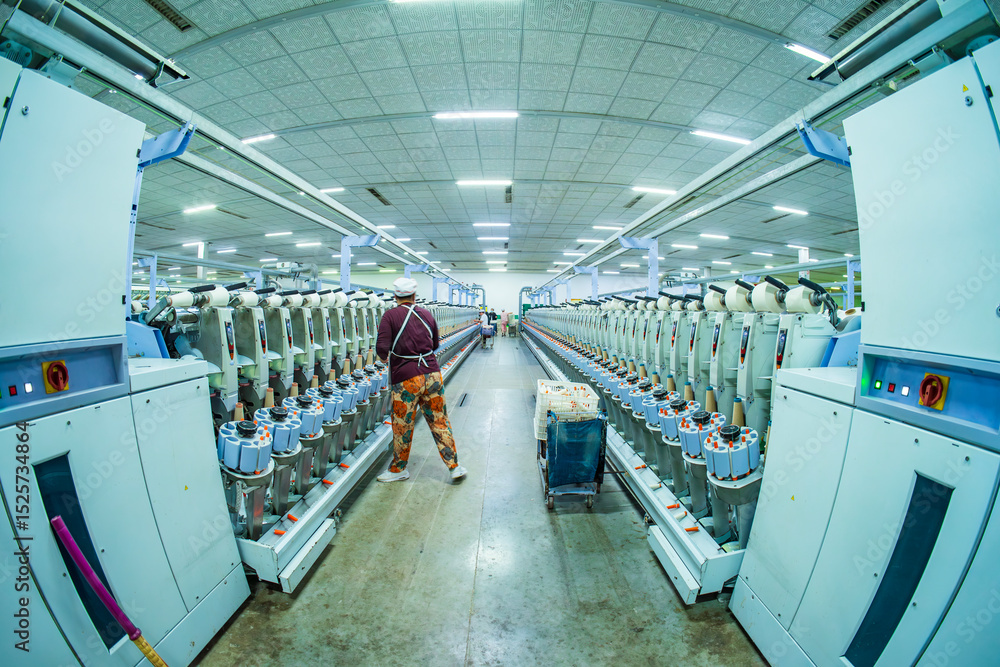 Naklejka premium Workers are working in the production workshop of the spinning mill
