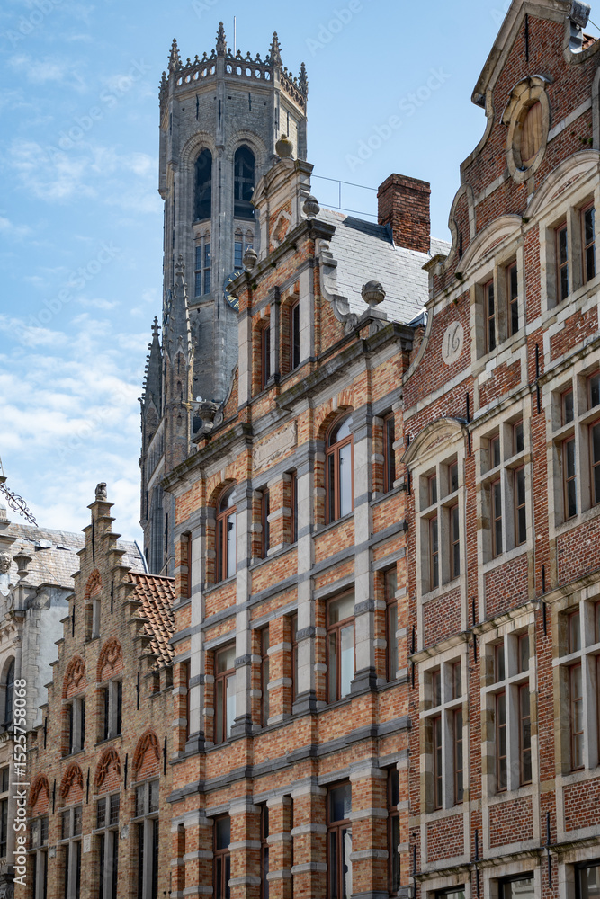 Fototapeta premium Medieval houses facades and rooftops and city tower with bells in the centre of Bruges, Flanders