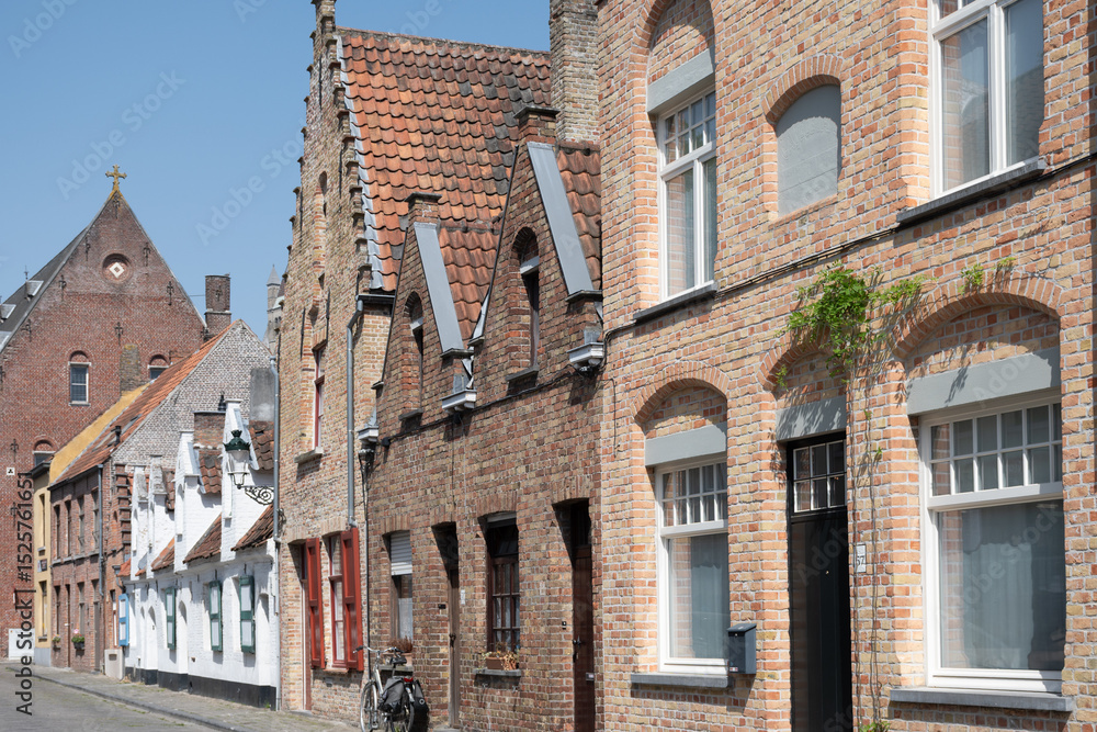 Fototapeta premium Old medieval houses in narrow streets in central Bruges, Flanders, Belgium, tourists destination in Europe