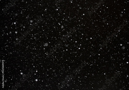 Falling snow creates a mesmerizing winter scene on a dark night