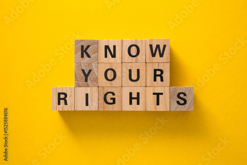 Know your rights written on wooden blocks on yellow background