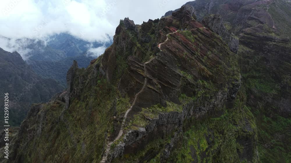Wooden stairs climbing the mountain peak of Pico do Arieiro, Madeira island, Portugal, aerial view Wooden stairs climbing the mountain peak of Pico do Arieiro, Madeira island, Portugal, aerial view
