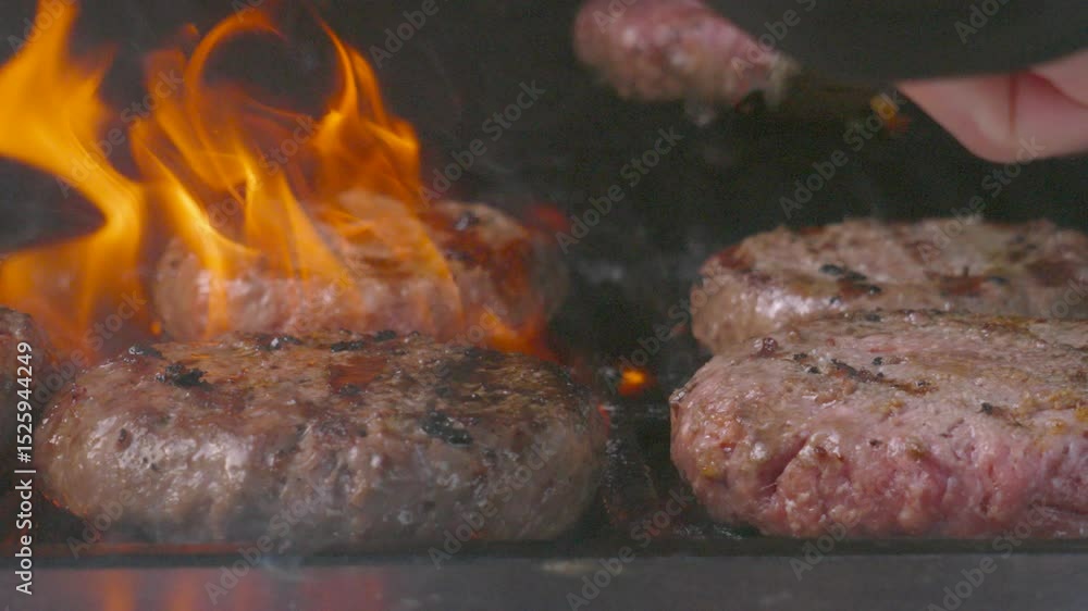 Collection of Juicy Beef Burgers on Flame Grill BBQ with Welldone and Medium Rare Patties. High Quality Outdoor Summer Cooking Footage. Spatula Used to Flip Meat. Collection of Juicy Beef Burgers on Flame Grill BBQ with Welldone and Medium Rare Patties. High Quality Outdoor Summer Cooking Footage. Spatula Used to Flip Meat.