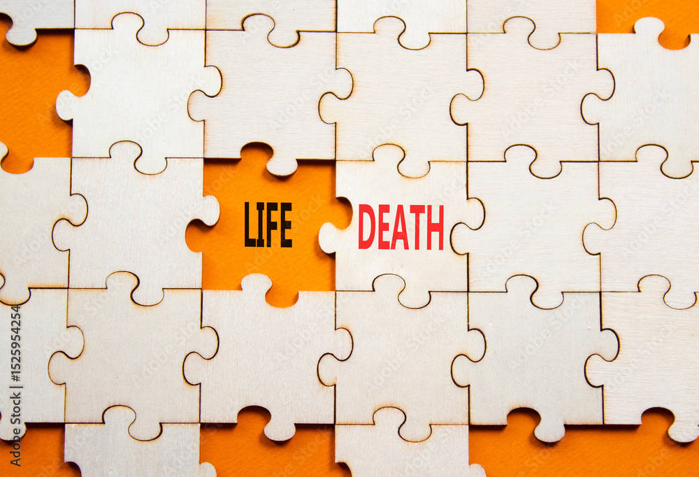 Fototapeta premium Life or Death symbol. Concept word Life or Death on wooden puzzle. Beautiful orange background. Business and Life or Death concept. Copy space