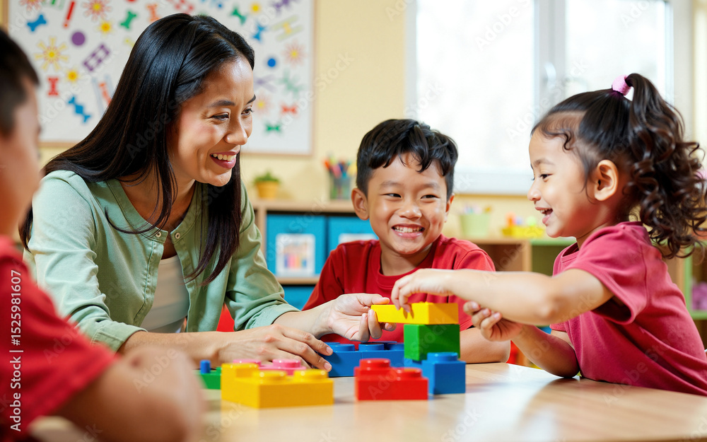 Fototapeta premium Smiling Asian Teacher and Two Young Children Playing with Colorful Building Blocks in a Preschool Classroom. Creativity and Skill Development Through Play-Based Learning