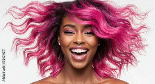 Smiling person with vibrant pink hair showing joy and style