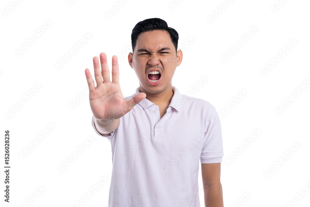 Angry young man showing stop hand gesture with serious facial expression isolated on transparent background Angry young man showing stop hand gesture with serious facial expression isolated on transparent background
