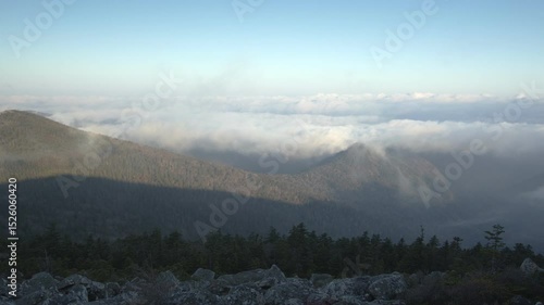 Morning fog in the mountains. Timelapse
