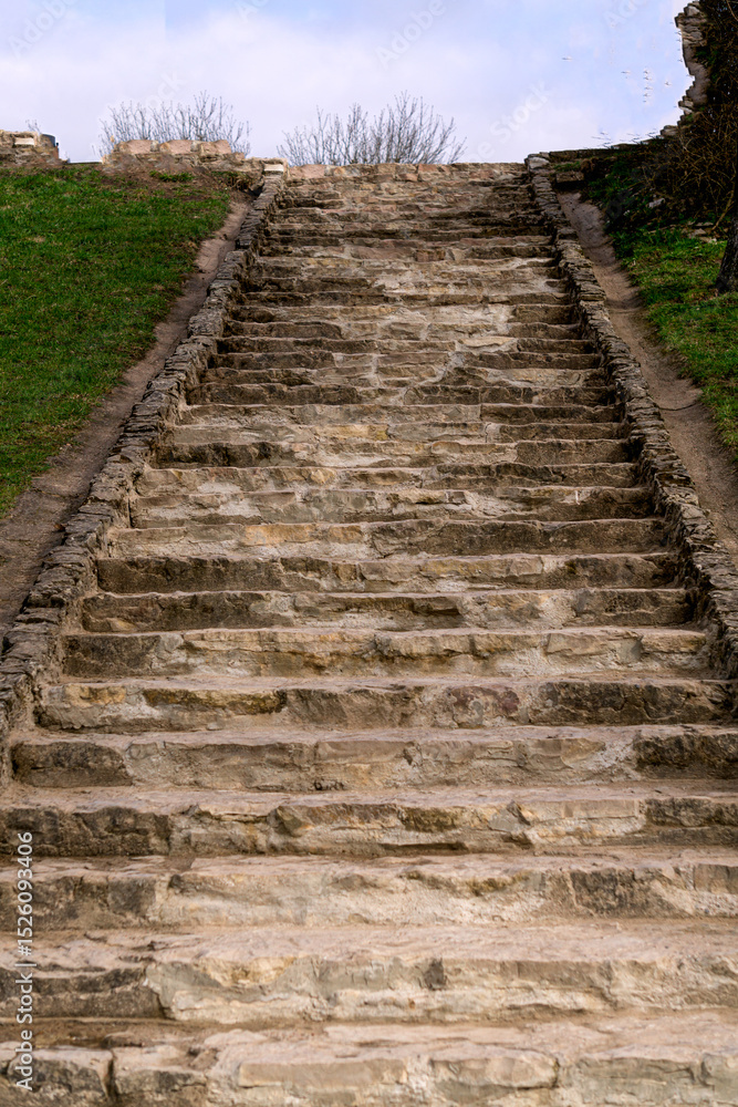 Fototapeta premium Old stone staircase made of dolomite.