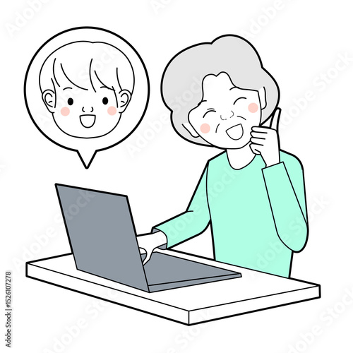 パソコンで孫とお話するシニア女性