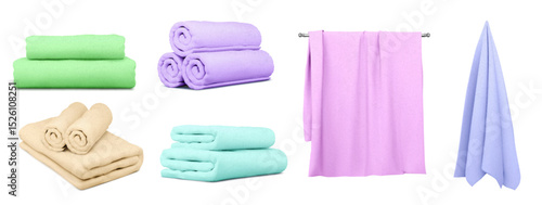 Colorful bath towels collection - green stacked, purple rolled, beige with washcloths, turquoise folded sets, pink hanging on rail, blue draped. Soft cotton textile assortment for spa and home use.