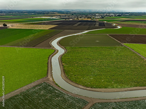 Following old Salinas River through rich crop fields near Castroville, CA.   Rich patterns of green vegetation.  