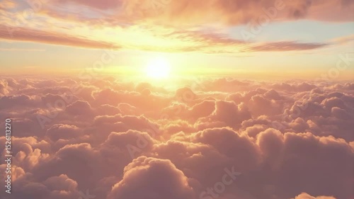 A breathtaking view of a bright sunset shining over a vast expanse of soft, fluffy clouds.