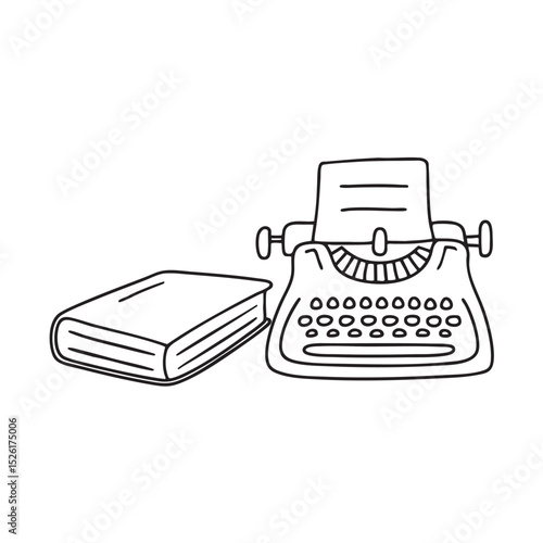 A typewriter next to a closed book