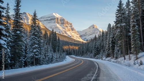 Winter Road and Mountainscape: A scenic winter landscape features a winding road, flanked by snow-laden trees, leading towards majestic, snow-capped mountains under a clear, bright sky. 