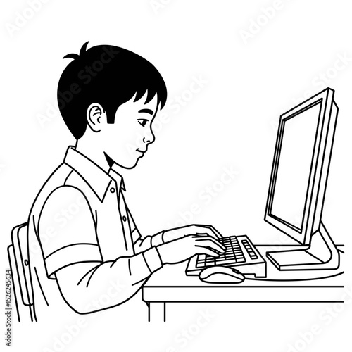 Boy focused on typing at a computer, studying in a classroom setting