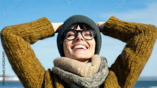 Happy woman, winter seaside, relaxing, clear sky, joyful, travel