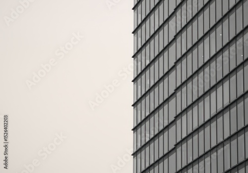 Wallpaper Mural Modern architecture featuring a glass facade against a neutral sky, creating a minimalist composition Torontodigital.ca