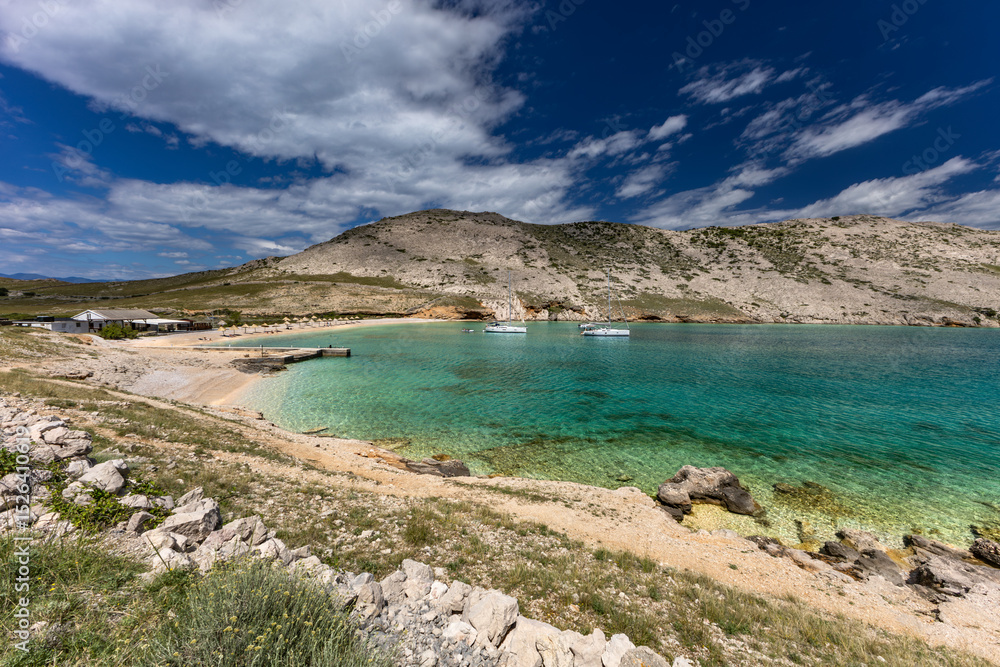 Panorama of the bay with the Vela Luka beach below, view of the beach from the top of the mountain, rocky beach Panorama of the bay with the Vela Luka beach below, view of the beach from the top of the mountain, rocky beach