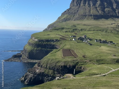 Múlafossur Waterfall beside the historic village of Gásadalur on Vágar Island, Faroe Islands. A timeless landscape rich in Faroese heritage and coastal tradition.