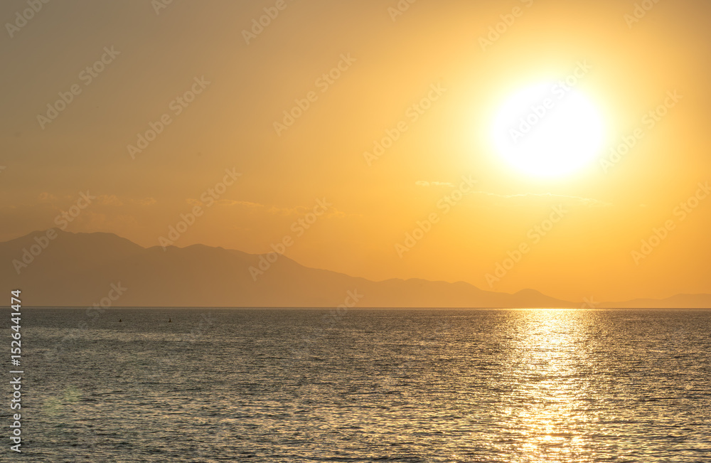 Fototapeta premium sunset over Van lake and big looking sun