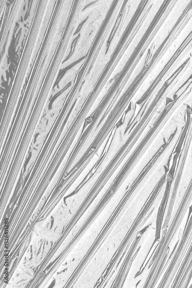 Obraz premium plastic overlay texture of realistic crumpled transparent plastic film wrap on black background,wrinkled stretched plastic effect.