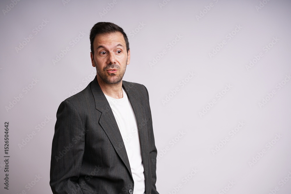 Fototapeta premium Male Model Showing Different Emotions on White Studio Background