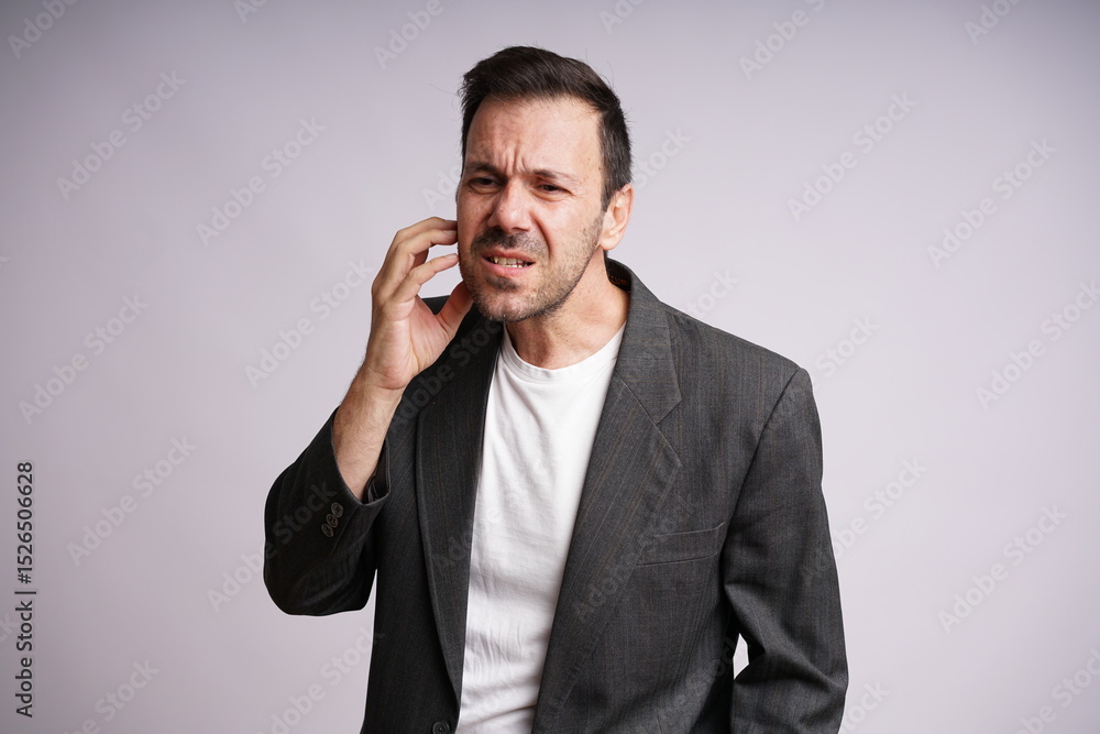 Male Model Showing Different Emotions on White Studio Background Male Model Showing Different Emotions on White Studio Background