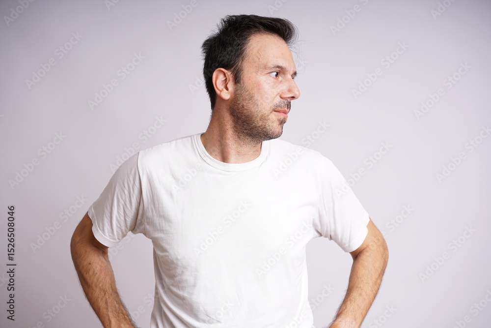 Fototapeta premium Male Model Showing Different Emotions on White Studio Background