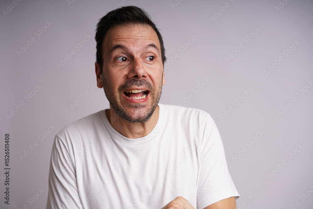 Fototapeta premium Male Model Showing Different Emotions on White Studio Background