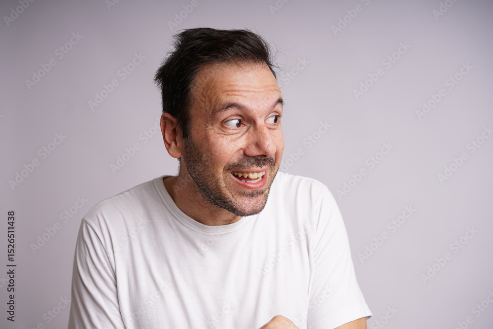 Fototapeta premium Male Model Showing Different Emotions on White Studio Background