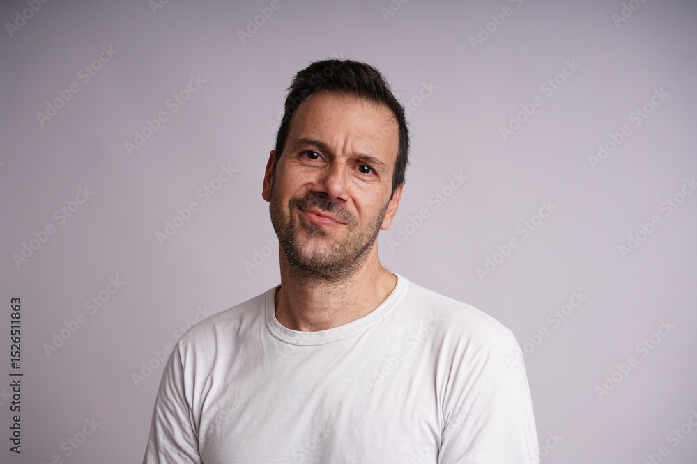 Fototapeta premium Male Model Showing Different Emotions on White Studio Background