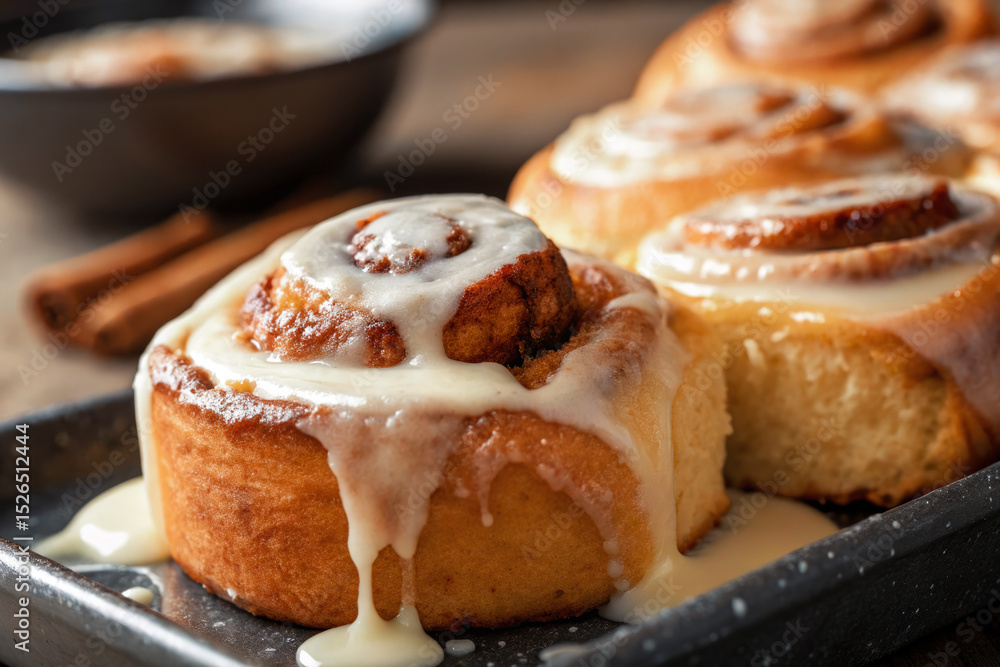 Close up of fresh baked cinnamon rolls with a sweet icing drizzle. Close up of fresh baked cinnamon rolls with a sweet icing drizzle.