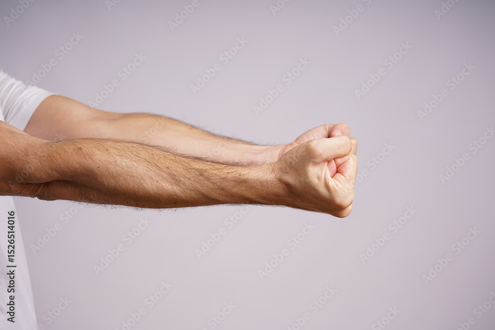 Expressive Male Hands on White Background in Studio Lighting Expressive Male Hands on White Background in Studio Lighting