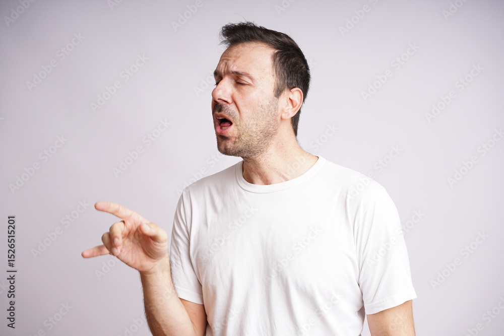 Fototapeta premium Male Model Showing Different Emotions on White Studio Background