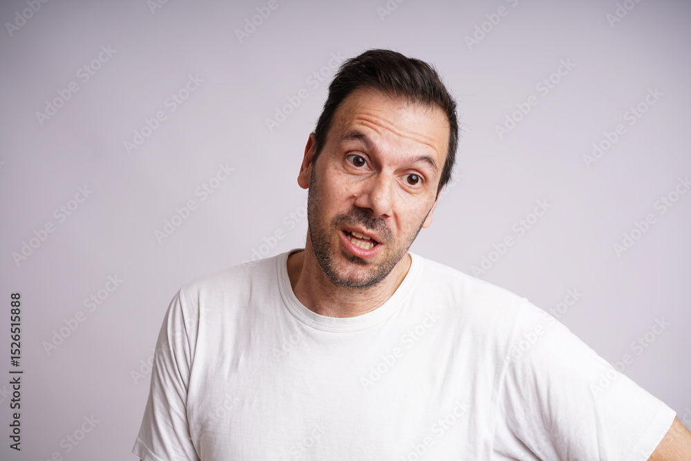 Male Model Showing Different Emotions on White Studio Background Male Model Showing Different Emotions on White Studio Background