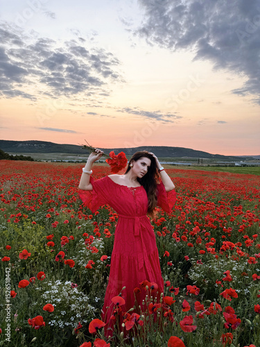 Wallpaper Mural beautiful slavic woman with dark hair in elegant clothes posing in a field of blooming red poppies at sunset Torontodigital.ca