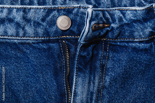 Foto Unzipped dark blue jeans, close up of denim pants detail