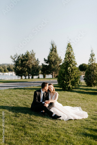 bride and groom walking in the park