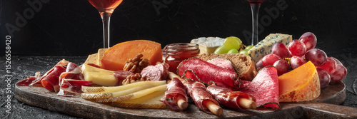Antipasti or tapas panorama. Charcuterie and cheese board. Spanish and Italian gourmet food and drinks, delicatessen