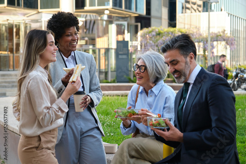 Multi ethnic colleagues enjoying a healthy lunch break together outdoors, fostering camaraderie and work life balance