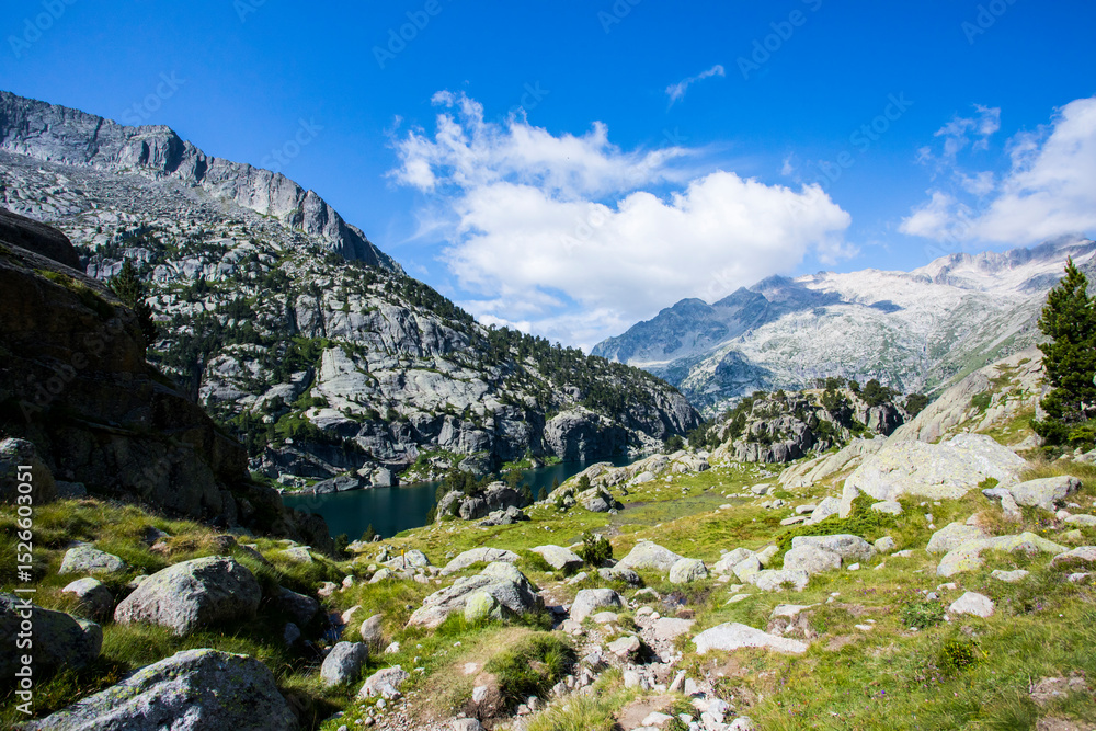 Young hiker woman in Vall de Boi, Aiguestortes and Sant Maurici National Park, Spain Young hiker woman in Vall de Boi, Aiguestortes and Sant Maurici National Park, Spain