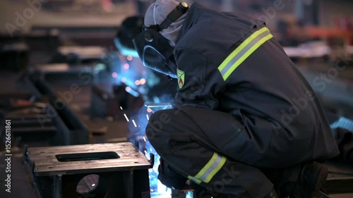 Welding Process in Industrial Setting is characterized by intense Sparks and Smoke