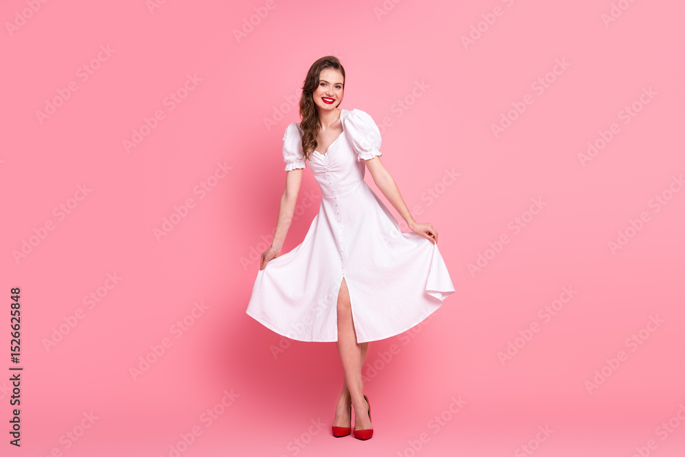Young stylish woman in white dress smiling on pink background, showcasing cheerful and charming elegance for creative advertising Young stylish woman in white dress smiling on pink background, showcasing cheerful and charming elegance for creative advertising