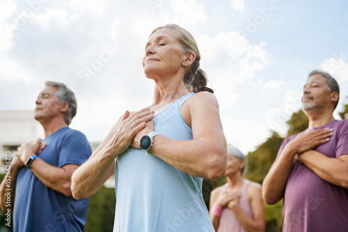 Wallpaper Mural Active mature multiethnic people practicing meditation at park Torontodigital.ca