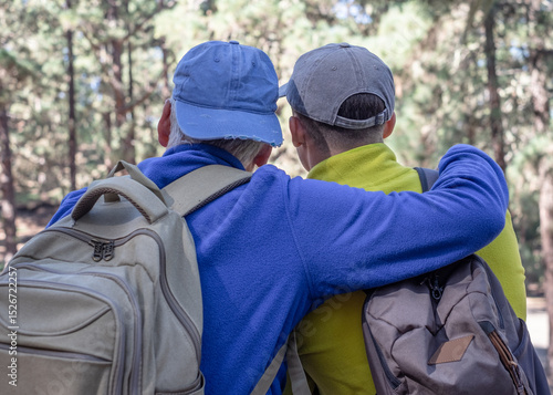 Wallpaper Mural Rear view of Grandfather and Grandson Hiking Together in Pine Forest-Multi-Generational Family Shares Passion for Nature and Healthy Lifestyle Torontodigital.ca