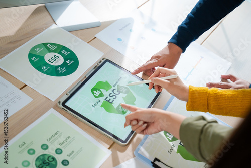 Wallpaper Mural Young Asian business team discussion reusable product in office,start up eco-friendly business,environmental protection,sustainable business model,ESG strategy,team meeting,people work at home concept Torontodigital.ca